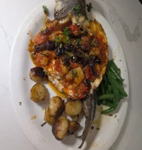 A whole-baked Branzino, a signature seafood dish at Pepe & Sale in Stuart, FL.
