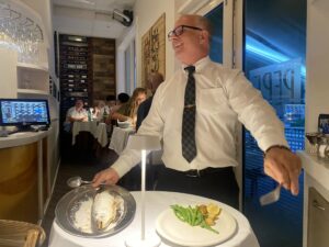 A group of women enjoying wine and pasta during a girls night out at Pepe and Sale in Stuart FL